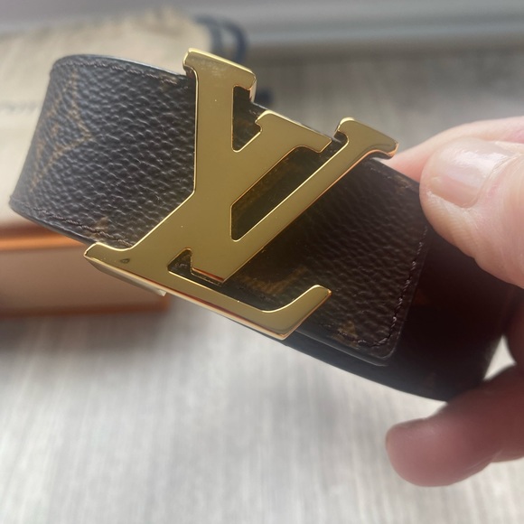 Louis Vuitton Accessories - Louis Vuitton reversible belt with signature gold tone LV buckle. Never worn.